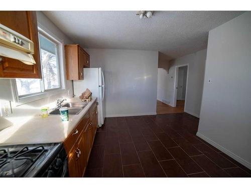 1322 34 Street Se, Calgary, AB - Indoor Photo Showing Kitchen With Double Sink