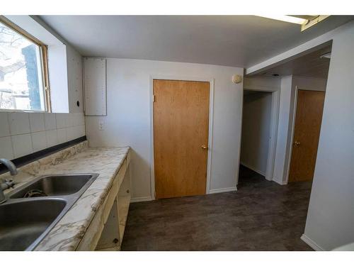 1322 34 Street Se, Calgary, AB - Indoor Photo Showing Kitchen With Double Sink