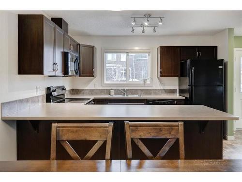 91 Sunset Road, Cochrane, AB - Indoor Photo Showing Kitchen