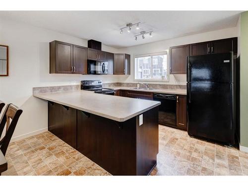 91 Sunset Road, Cochrane, AB - Indoor Photo Showing Kitchen