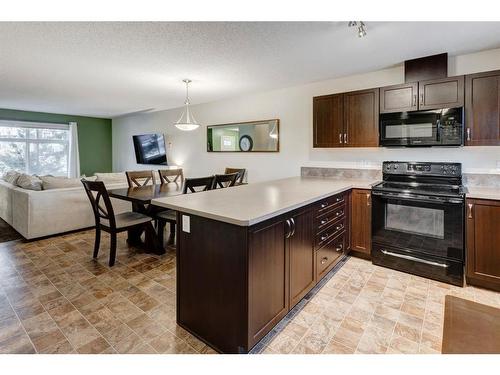 91 Sunset Road, Cochrane, AB - Indoor Photo Showing Kitchen