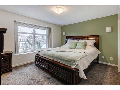 91 Sunset Road, Cochrane, AB - Indoor Photo Showing Bedroom