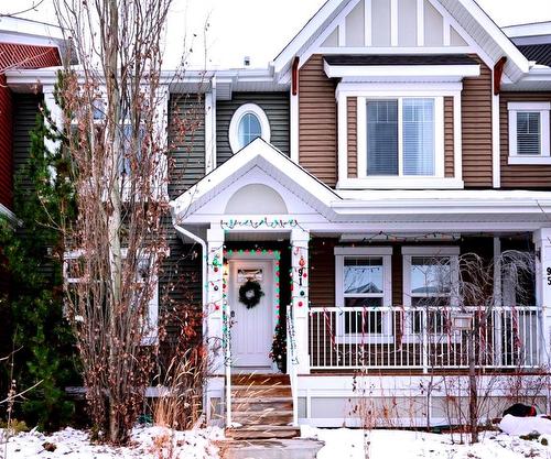 91 Sunset Road, Cochrane, AB - Outdoor With Deck Patio Veranda With Facade