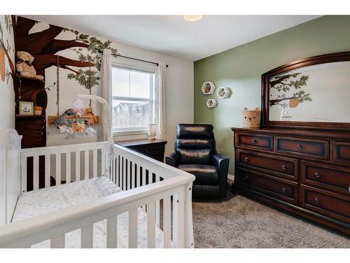 91 Sunset Road, Cochrane, AB - Indoor Photo Showing Bedroom