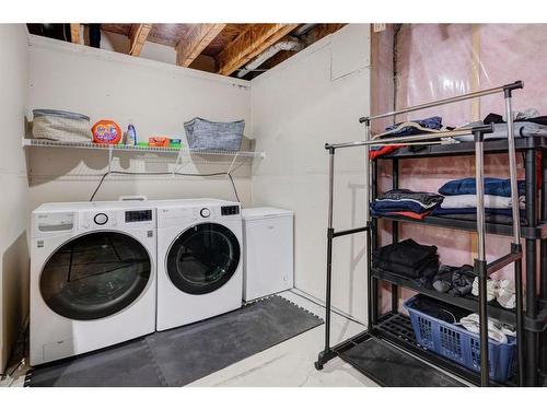 91 Sunset Road, Cochrane, AB - Indoor Photo Showing Laundry Room