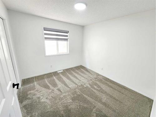 15 Coral Reef Close Ne, Calgary, AB - Indoor Photo Showing Other Room