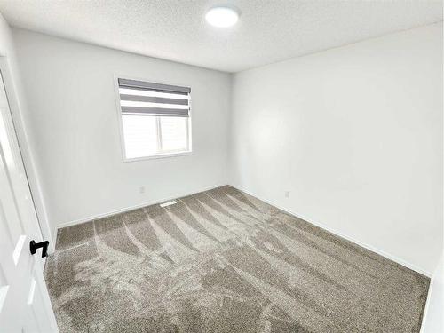 15 Coral Reef Close Ne, Calgary, AB - Indoor Photo Showing Other Room