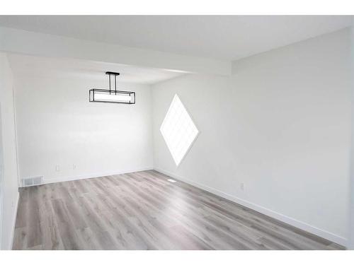 15 Coral Reef Close Ne, Calgary, AB - Indoor Photo Showing Other Room