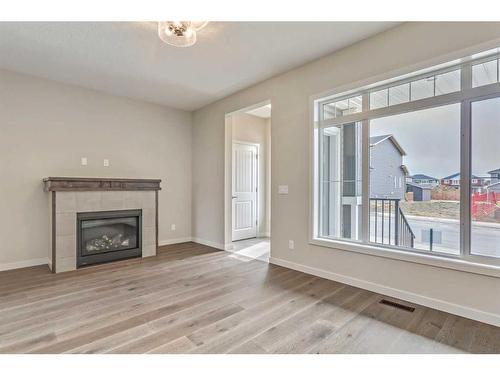 20 Emberside Grove, Cochrane, AB - Indoor Photo Showing Living Room With Fireplace