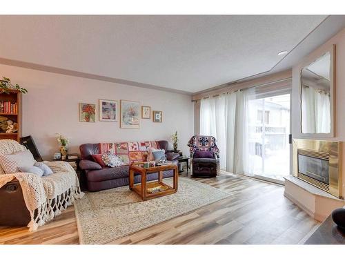 2416 25A Street Sw, Calgary, AB - Indoor Photo Showing Living Room With Fireplace