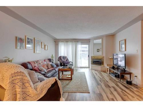 2416 25A Street Sw, Calgary, AB - Indoor Photo Showing Living Room With Fireplace