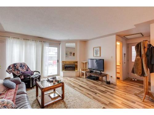 2416 25A Street Sw, Calgary, AB - Indoor Photo Showing Living Room With Fireplace