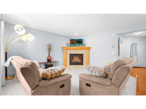 113 Covehaven Gardens Ne, Calgary, AB - Indoor Photo Showing Living Room With Fireplace