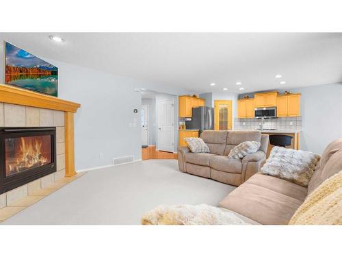 113 Covehaven Gardens Ne, Calgary, AB - Indoor Photo Showing Living Room With Fireplace