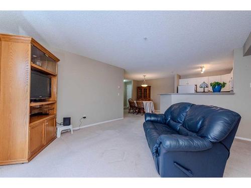 1203-4975 130 Avenue Se, Calgary, AB - Indoor Photo Showing Living Room