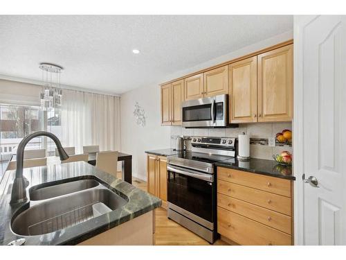 39 Everwillow Close Sw, Calgary, AB - Indoor Photo Showing Kitchen With Double Sink