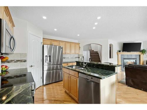 39 Everwillow Close Sw, Calgary, AB - Indoor Photo Showing Kitchen With Stainless Steel Kitchen With Double Sink