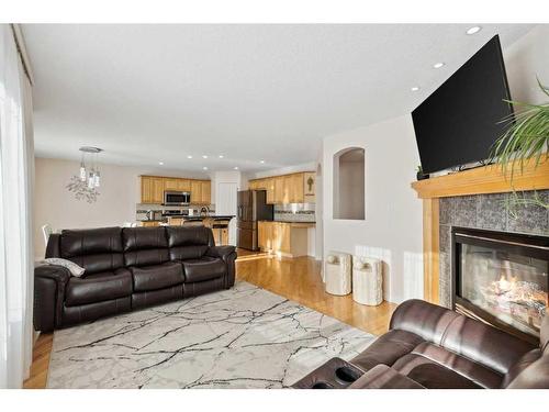 39 Everwillow Close Sw, Calgary, AB - Indoor Photo Showing Living Room With Fireplace