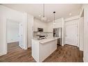 2311-111 Wolf Creek Drive Se, Calgary, AB  - Indoor Photo Showing Kitchen With Double Sink 