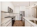 2311-111 Wolf Creek Drive Se, Calgary, AB  - Indoor Photo Showing Kitchen With Stainless Steel Kitchen 