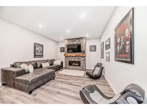 136 Riviera Way, Cochrane, AB - Indoor Photo Showing Living Room With Fireplace