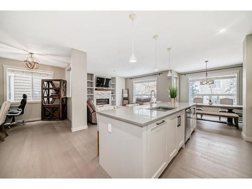 136 Riviera Way, Cochrane, AB - Indoor Photo Showing Kitchen With Double Sink With Upgraded Kitchen