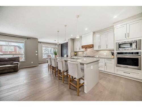 136 Riviera Way, Cochrane, AB - Indoor Photo Showing Kitchen With Upgraded Kitchen