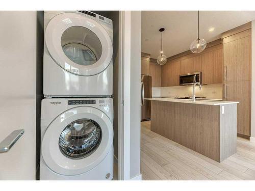 1208-111 Wolf Creek Drive, Calgary, AB - Indoor Photo Showing Laundry Room