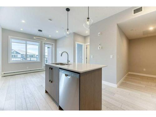 1208-111 Wolf Creek Drive, Calgary, AB - Indoor Photo Showing Kitchen With Upgraded Kitchen