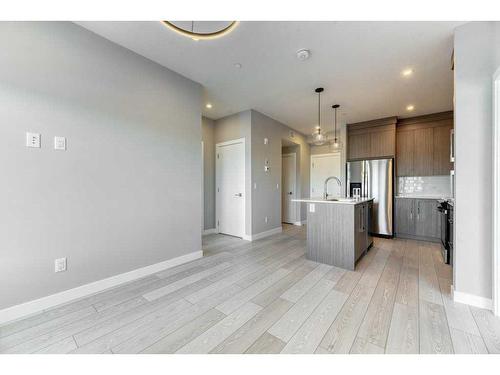 1208-111 Wolf Creek Drive, Calgary, AB - Indoor Photo Showing Kitchen