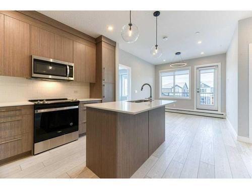 1208-111 Wolf Creek Drive, Calgary, AB - Indoor Photo Showing Kitchen With Upgraded Kitchen