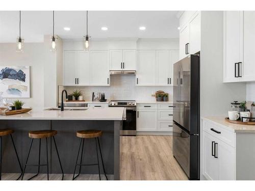 487 Kinniburgh Loop, Chestermere, AB - Indoor Photo Showing Kitchen With Stainless Steel Kitchen With Upgraded Kitchen