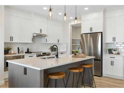 487 Kinniburgh Loop, Chestermere, AB - Indoor Photo Showing Kitchen With Stainless Steel Kitchen With Double Sink With Upgraded Kitchen