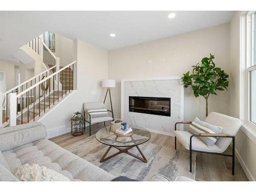 487 Kinniburgh Loop, Chestermere, AB - Indoor Photo Showing Living Room With Fireplace