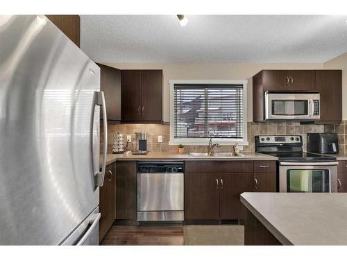 124 Panamount Way Nw, Calgary, AB - Indoor Photo Showing Kitchen With Stainless Steel Kitchen With Double Sink