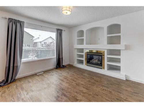 23 Saddleback Way Ne, Calgary, AB - Indoor Photo Showing Living Room With Fireplace