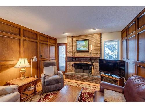 607 Whiteridge Road Ne, Calgary, AB - Indoor Photo Showing Living Room With Fireplace