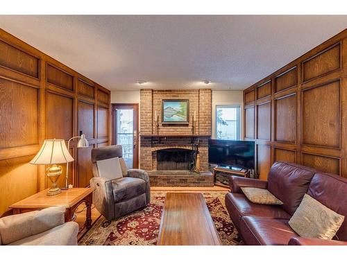 607 Whiteridge Road Ne, Calgary, AB - Indoor Photo Showing Living Room With Fireplace