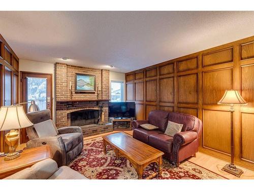 607 Whiteridge Road Ne, Calgary, AB - Indoor Photo Showing Living Room With Fireplace