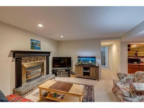 607 Whiteridge Road Ne, Calgary, AB - Indoor Photo Showing Living Room With Fireplace