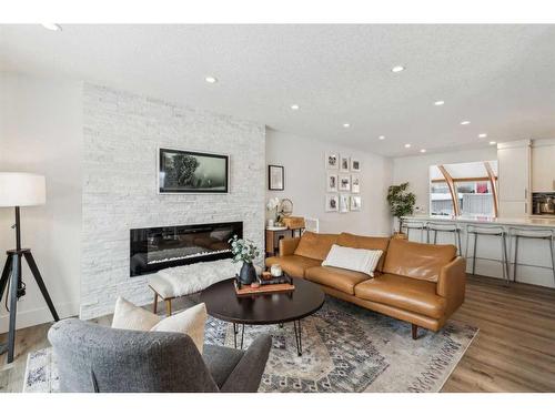 2055 33 Street Se, Calgary, AB - Indoor Photo Showing Living Room With Fireplace