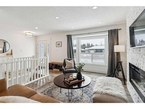 2055 33 Street Se, Calgary, AB - Indoor Photo Showing Living Room With Fireplace