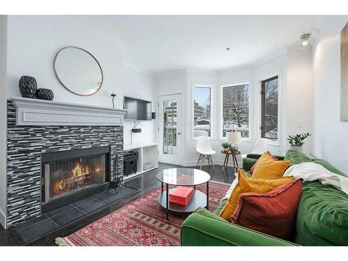 304-916 19 Avenue Sw, Calgary, AB - Indoor Photo Showing Living Room With Fireplace