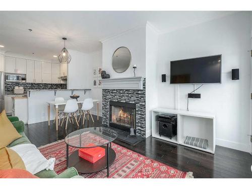 304-916 19 Avenue Sw, Calgary, AB - Indoor Photo Showing Living Room With Fireplace