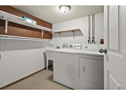 8 Taraglen Road Ne, Calgary, AB - Indoor Photo Showing Laundry Room