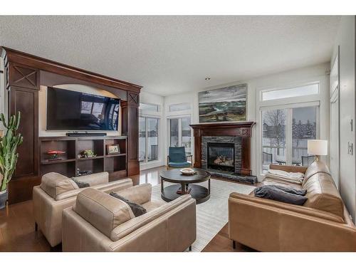 221 Tuscany Estates Rise Nw, Calgary, AB - Indoor Photo Showing Living Room With Fireplace