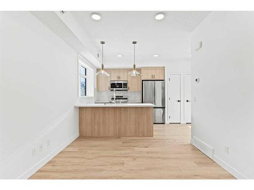 312-562 Seton Circle Se, Calgary, AB - Indoor Photo Showing Kitchen With Stainless Steel Kitchen With Upgraded Kitchen