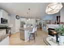 16 Ridge View Close, Cochrane, AB  - Indoor Photo Showing Kitchen With Fireplace With Stainless Steel Kitchen With Upgraded Kitchen 