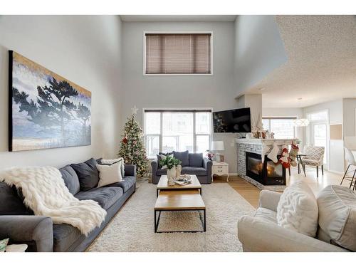 16 Ridge View Close, Cochrane, AB - Indoor Photo Showing Living Room With Fireplace