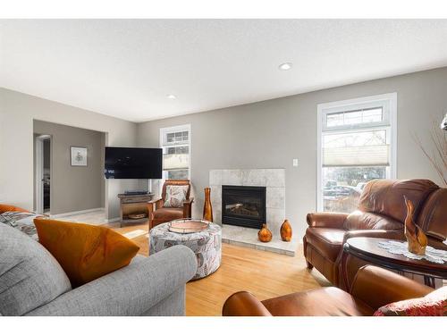 204 Doverthorn Close Se, Calgary, AB - Indoor Photo Showing Living Room With Fireplace